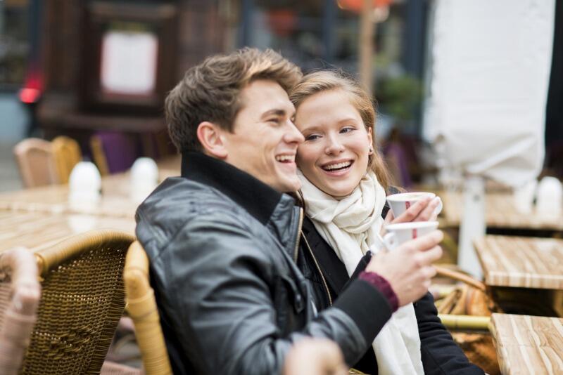 A young couple enjoys a warm beverage in Downtown Holland, Michigan.